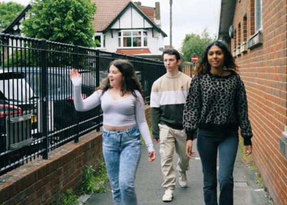 Three young people walking