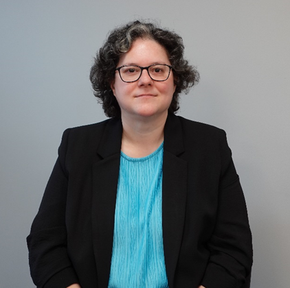 Person wearing black jacket and glasses