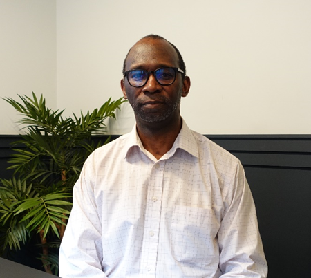 Person wearing white shirt and glasses